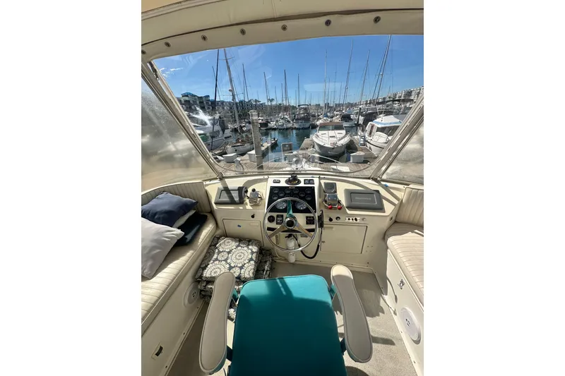 Slide: The Image of Interior view of 1994 Oceans motor yacht cockpit with marina in background. - 25