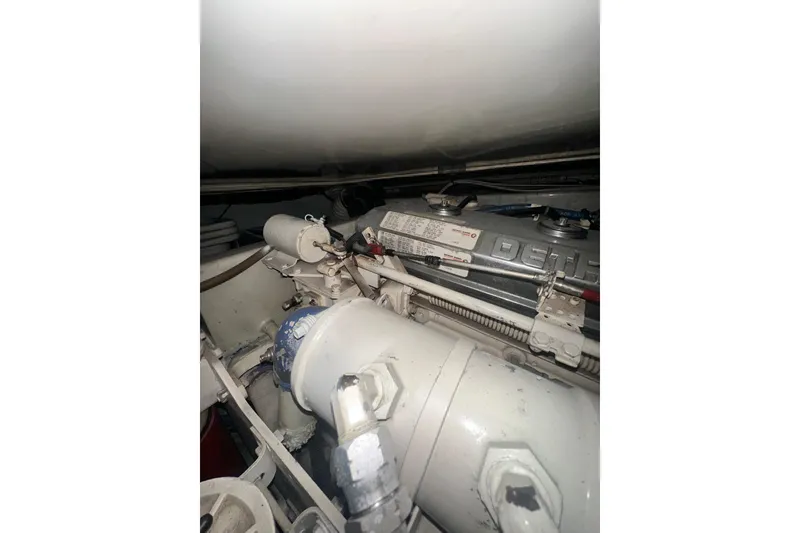 Slide: The Image of Engine room of a 1994 Oceans motor yacht, showcasing mechanical components and piping. - 5