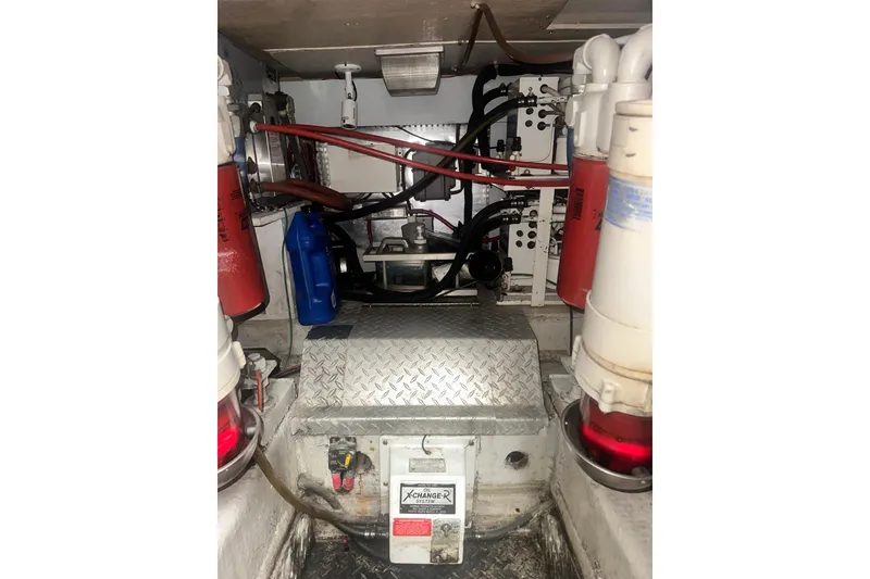 Slide: The Image of Engine room of a 1994 Oceans motor yacht with visible filters and wiring. - 8