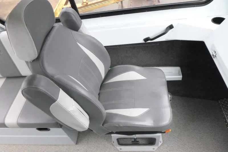 Slide: The Image of 2025 Hewescraft 240 Ocean Pro interior with gray and white cushioned seating. - 14