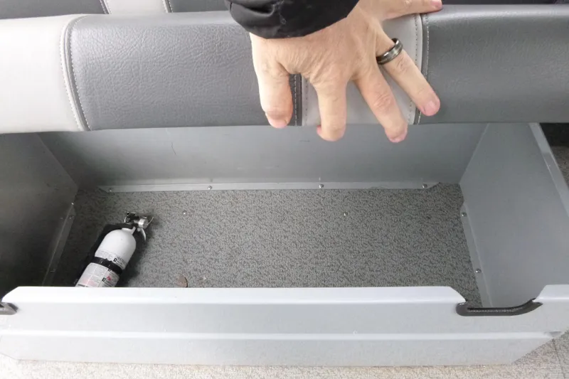 Slide: The Image of Storage compartment in 2025 Hewescraft 240 Ocean Pro boat with fire extinguisher. - 16