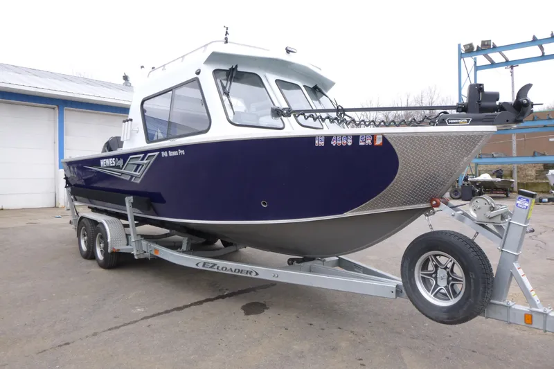 Slide: The Image of 2025 Hewescraft 240 Ocean Pro boat on trailer, parked outdoors. - 3