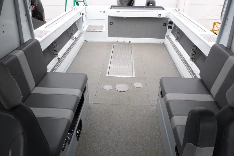 Slide: The Image of Interior of 2025 Hewescraft 240 Ocean Pro boat with seating and storage. - 6