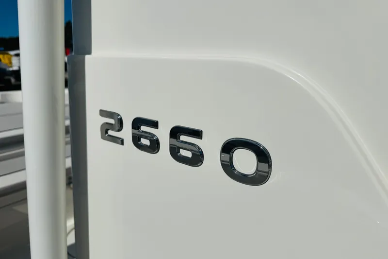 Slide: The Image of Close-up of 2022 Ranger 2660 Bay model emblem on white surface. - 10