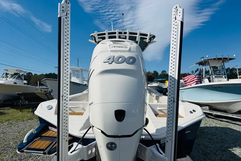 Slide: The Image of 2022 Ranger 2660 Bay boat with powerful 400 horsepower engine, displayed outdoors. - 5