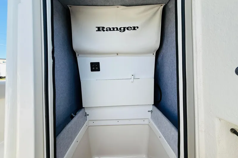 Slide: The Image of Interior storage compartment of 2022 Ranger 2660 Bay boat, featuring a clean, organized design. - 8
