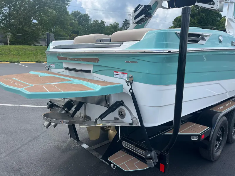 Slide: The Image of 2024 Centurion Ri230 boat with turquoise rear and platform. - 11