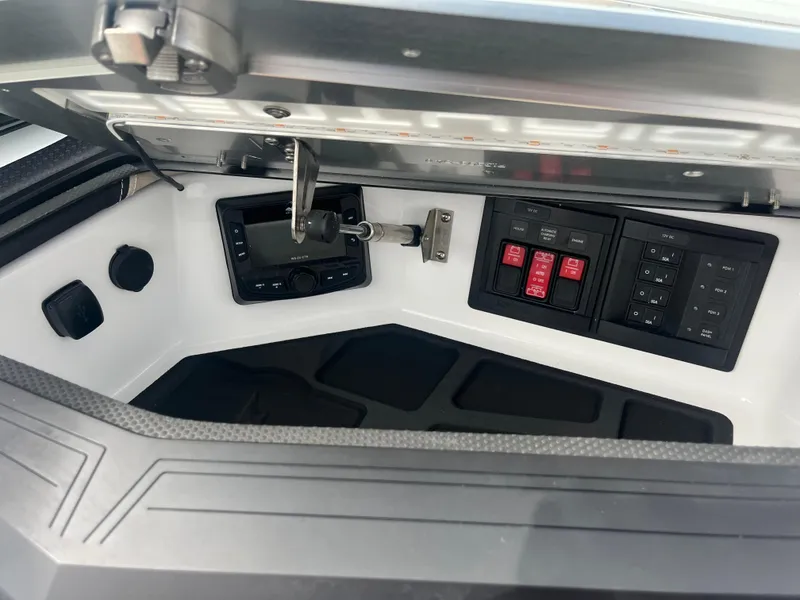 Slide: The Image of 2024 Centurion Ri230 control panel with switches and key. - 15