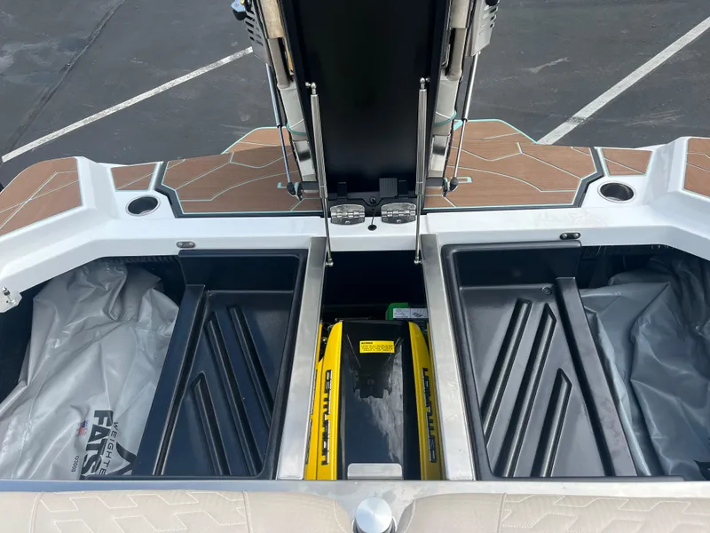 Slide: The Image of 2024 Centurion Ri230 boat interior with storage compartments and features. - 7