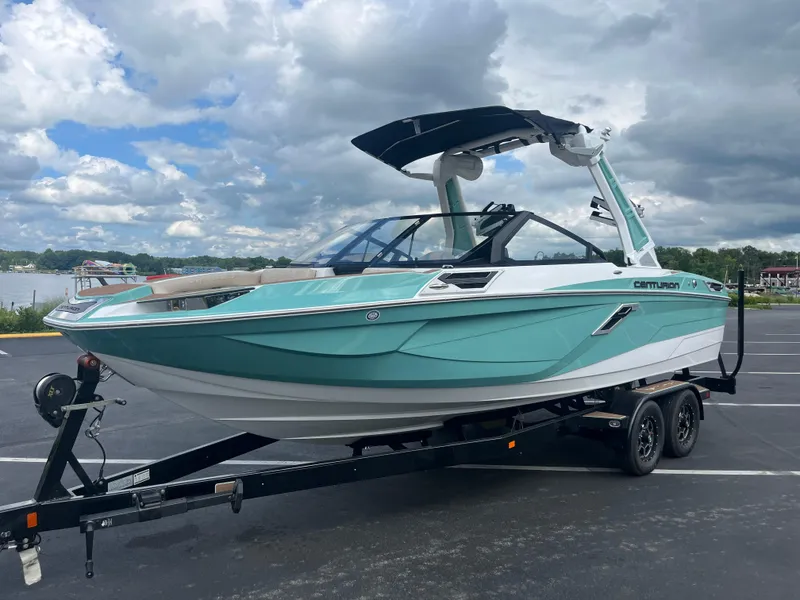 Slide: The Image of 2024 Centurion Ri230 boat on trailer, turquoise and white. - 8