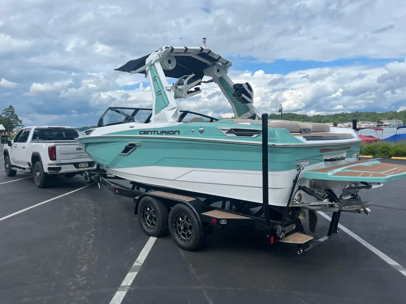 Slide: The Image of 2024 Centurion Ri230 boat on trailer, ready for adventure. - 9