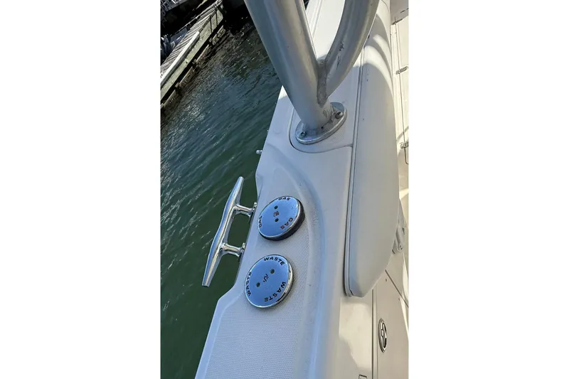 Slide: The Image of 2007 Boston Whaler 320 Outrage Cuddy Cabin deck with cleat and waste caps. - 19