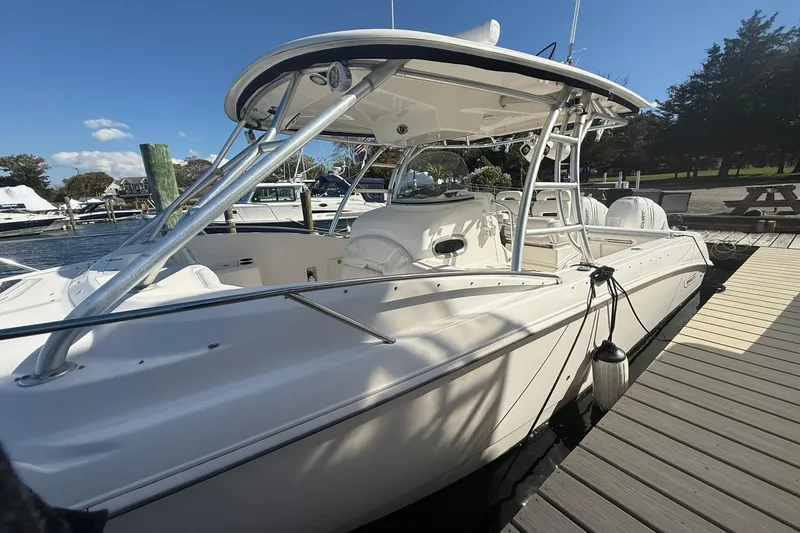 Slide: The Image of 2007 Boston Whaler 320 Outrage Cuddy Cabin docked at marina under clear sky. - 26