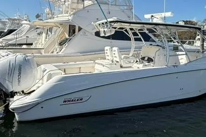 Slide: The Image of 2007 Boston Whaler 320 Outrage Cuddy Cabin docked at marina. - 3