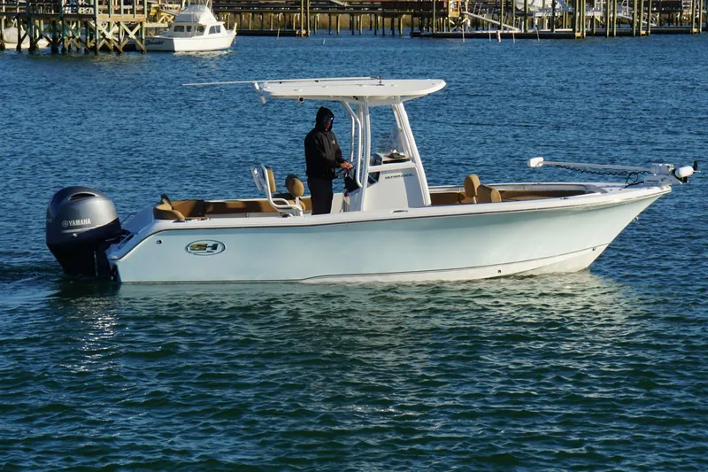 Slide: The Image of 2022 Sea Hunt Ultra 229 boat on water with Yamaha engine. - 6