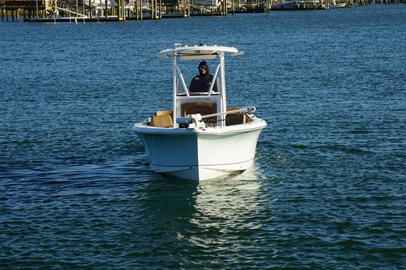 Slide: The Image of 2022 Sea Hunt Ultra 229 boat cruising on open water. - 8