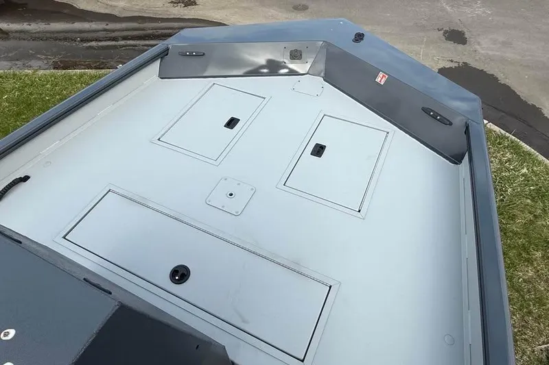 Slide: The Image of 2026 Crestliner 1870 Retriever FCC boat deck with storage compartments. - 9