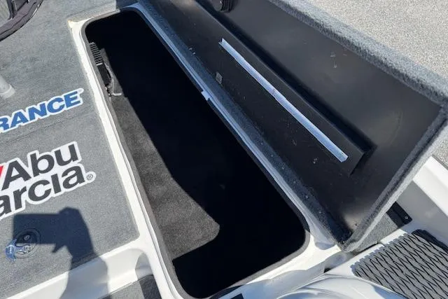 Slide: The Image of Open storage compartment on a 2004 Triton Tr-186 SC boat deck. - 17