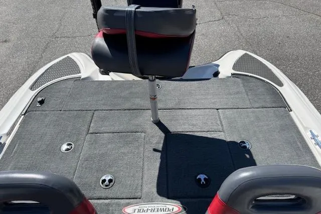 Slide: The Image of 2004 Triton Tr-186 SC boat deck with seating and Power-Pole logo. - 9