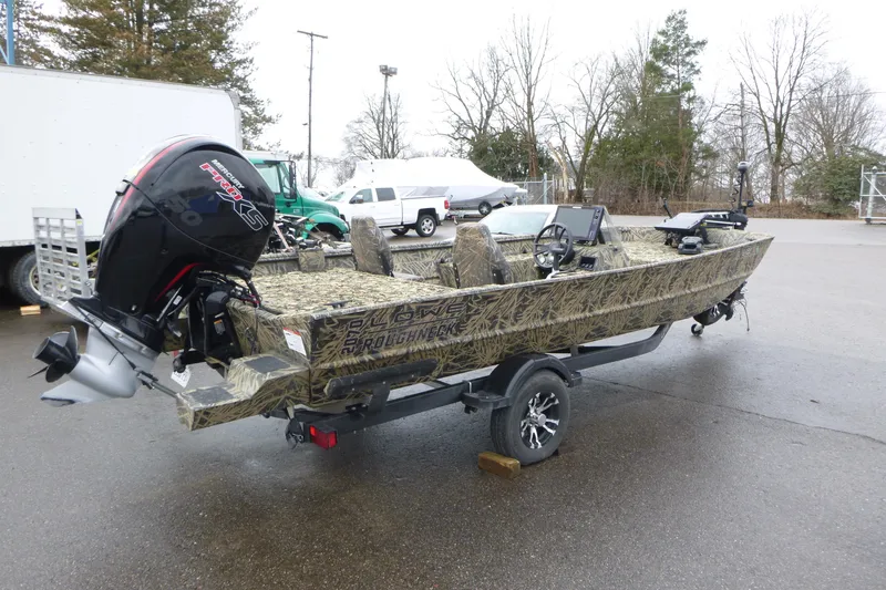 Slide: The Image of 2024 Lowe Roughneck 2070 boat with camouflage design and powerful outboard motor. - 16