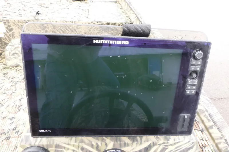Slide: The Image of Humminbird Solix 15 fish finder on 2024 Lowe Roughneck 2070 boat dashboard. - 27