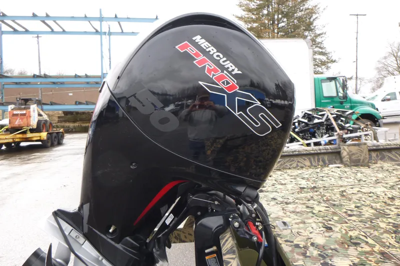 Slide: The Image of Mercury Pro XS outboard motor on 2024 Lowe Roughneck 2070 boat, outdoor setting. - 29