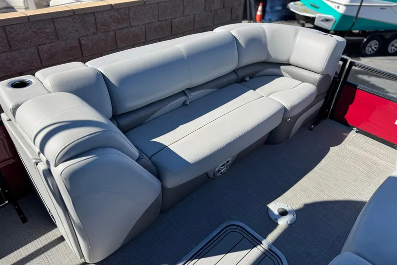 Slide: The Image of Luxurious seating on 2023 Regency 250 DL3 pontoon boat with gray upholstery. - 11