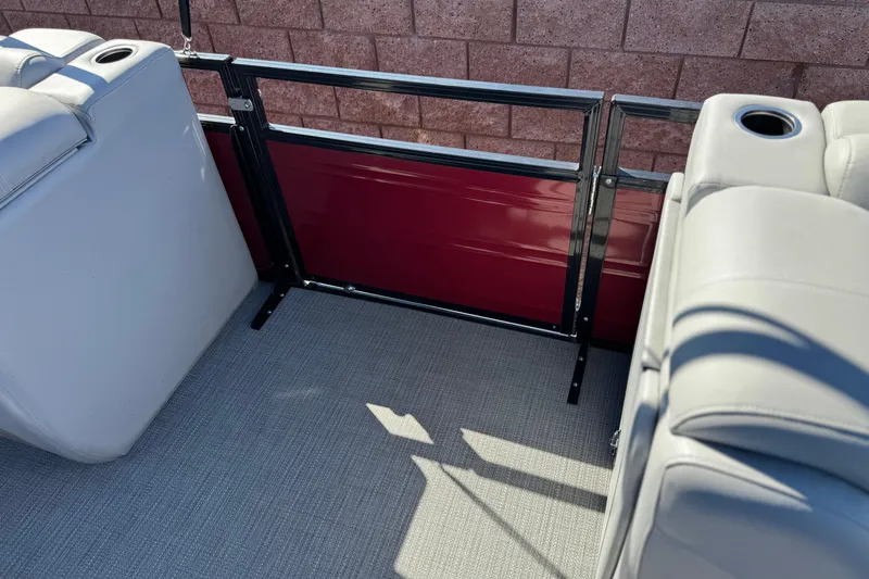 Slide: The Image of Interior of 2023 Regency 250 DL3 pontoon boat with seating and cup holders. - 16