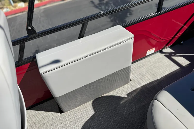Slide: The Image of 2023 Regency 250 DL3 boat interior with gray seating and red paneling. - 20