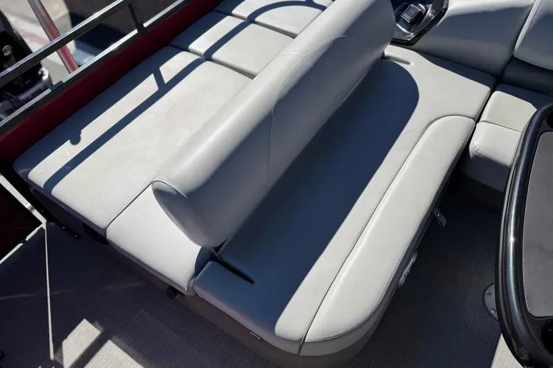 Slide: The Image of 2023 Regency 250 DL3 boat interior with gray seating and sleek design. - 23