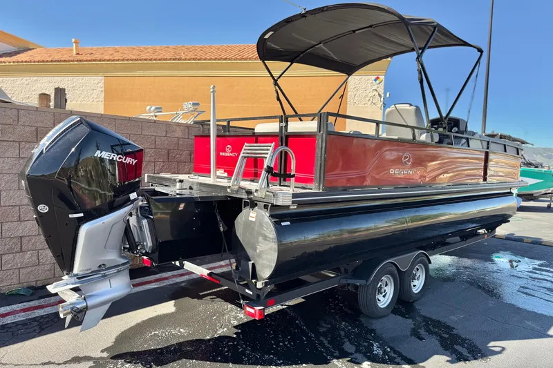 Slide: The Image of 2023 Regency 250 DL3 pontoon boat with Mercury engine on trailer. - 6
