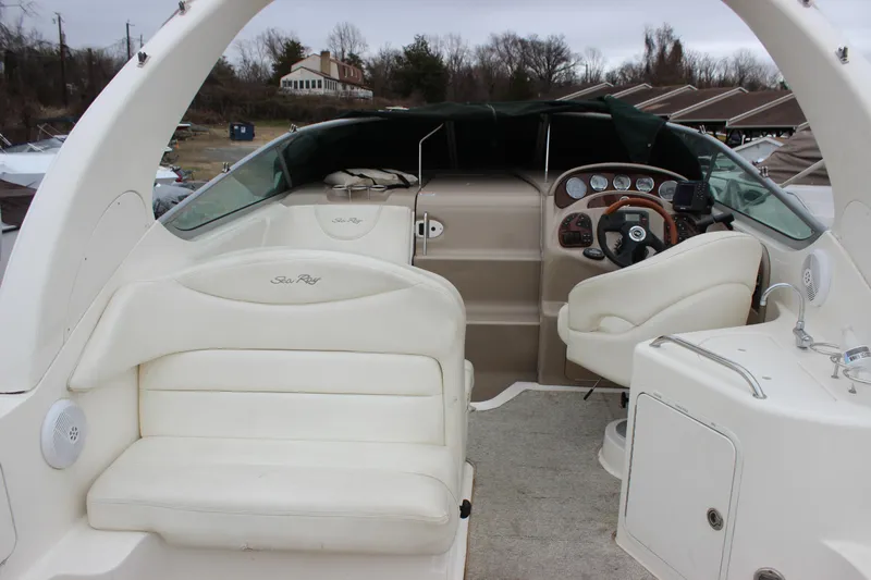 Slide: The Image of 2005 Sea Ray Sundancer 280 boat interior with helm and seating area. - 11