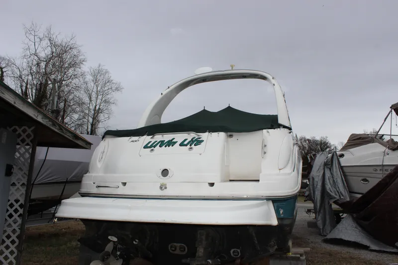 Slide: The Image of 2005 Sea Ray Sundancer 280 boat in storage, rear view with cover. - 5