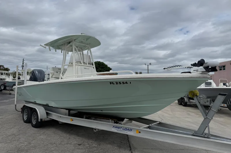 The Image of 2023 Pathfinder 2600 TRS boat on trailer under cloudy sky. - 1