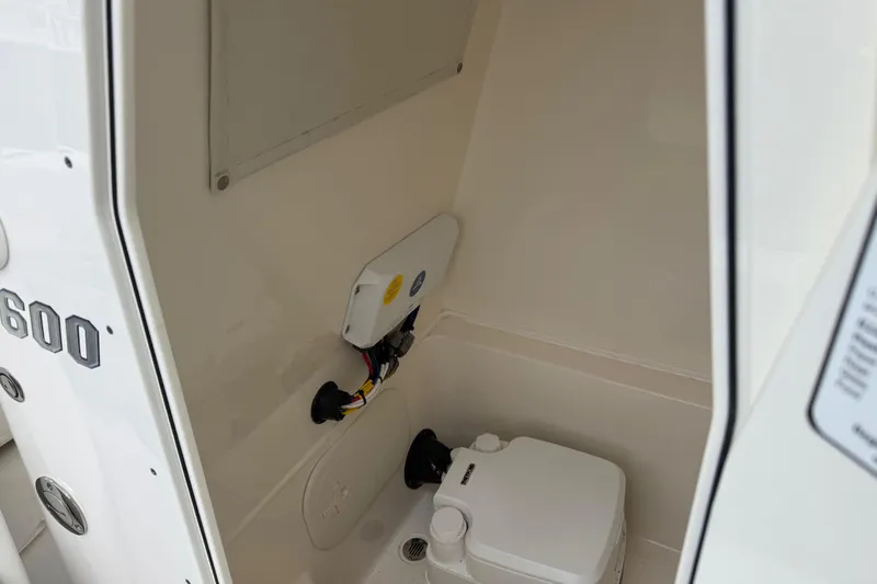 Slide: The Image of 2023 Pathfinder 2600 TRS boat interior with compact marine toilet. - 15
