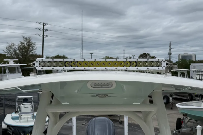 Slide: The Image of 2023 Pathfinder 2600 TRS boat with mounted LED light bar under cloudy sky. - 18