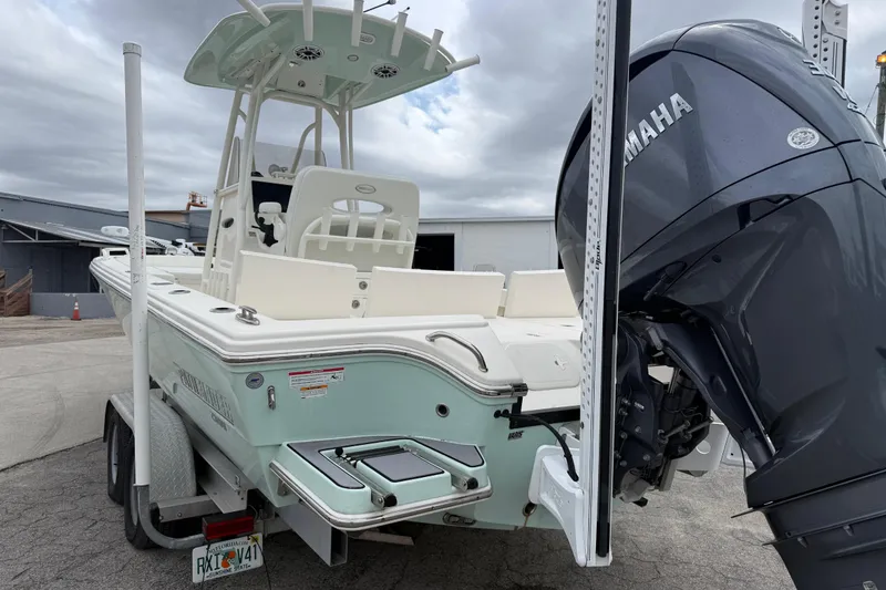 Slide: The Image of 2023 Pathfinder 2600 TRS boat with Yamaha engine on trailer, parked outdoors. - 3