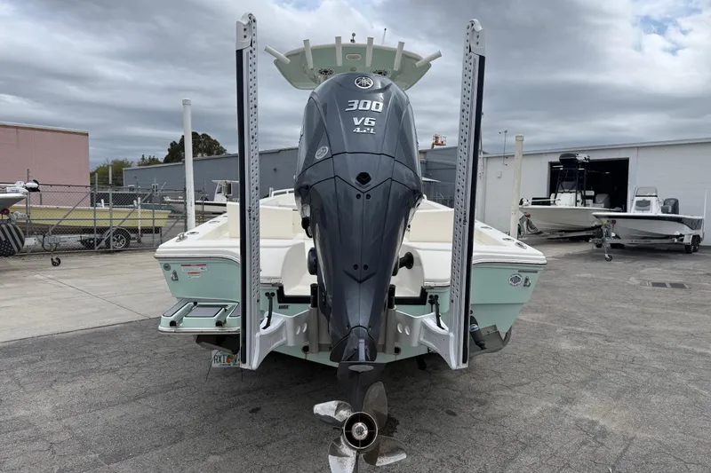 Slide: The Image of 2023 Pathfinder 2600 TRS boat with Yamaha 300 V6 engine, docked outdoors. - 4