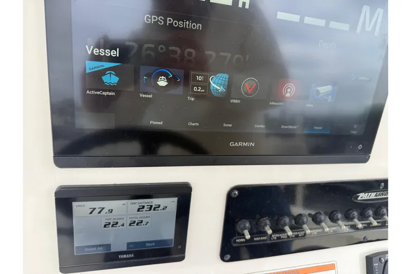 Slide: The Image of Garmin GPS and Yamaha display on 2023 Pathfinder 2600 TRS boat dashboard. - 5