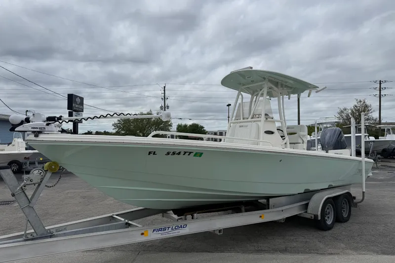 Slide: The Image of 2023 Pathfinder 2600 TRS boat on trailer, overcast sky background. - 6