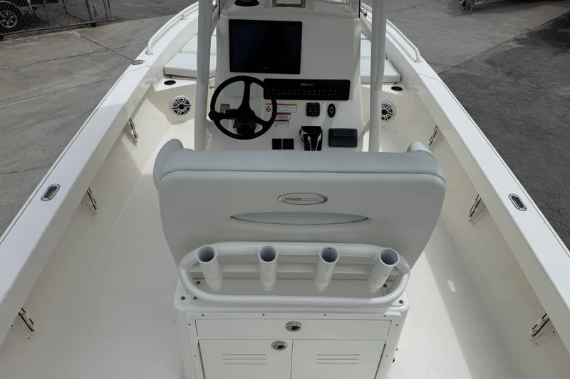 Slide: The Image of 2023 Pathfinder 2600 TRS boat interior with steering console and rod holders. - 9