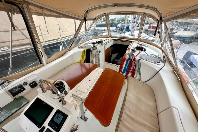 Slide: The Image of Cockpit of 2005 Beneteau Oceanis Clipper 423 sailboat with navigation instruments and seating. - 11