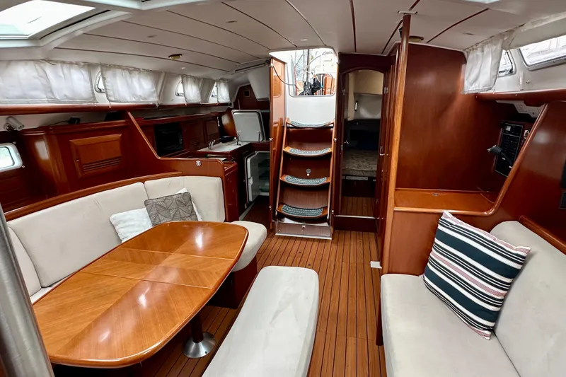 Slide: The Image of Luxurious interior of 2005 Beneteau Oceanis Clipper 423 yacht with wood finish and seating area. - 15