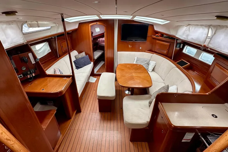 Slide: The Image of Luxurious interior of 2005 Beneteau Oceanis Clipper 423 yacht with elegant wood finish. - 16
