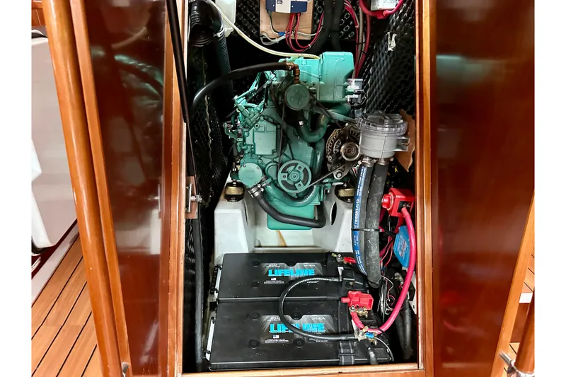 Slide: The Image of Engine compartment of a 2005 Beneteau Oceanis Clipper 423 sailboat, featuring Lifeline batteries. - 23