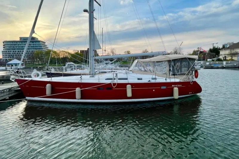Slide: The Image of 2005 Beneteau Oceanis Clipper 423 sailboat docked at marina during sunset. - 3