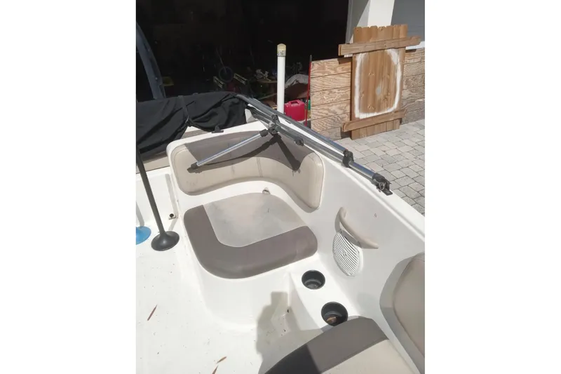 Slide: The Image of 2017 Bayliner Element E16 boat interior with seating and speaker. - 13