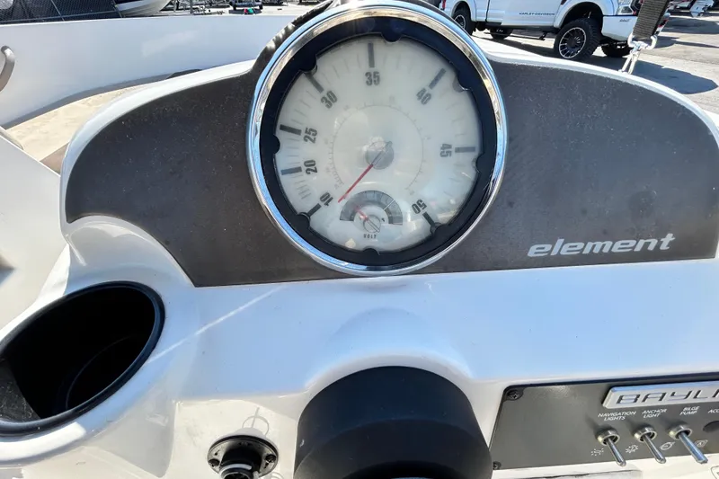 Slide: The Image of Dashboard of a 2017 Bayliner Element E16 boat with speedometer and controls. - 16