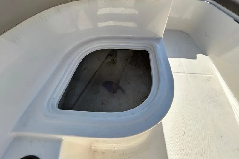 Slide: The Image of 2017 Bayliner Element E16 boat storage compartment, open and empty. - 19