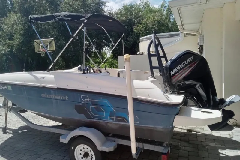 Slide: The Image of 2017 Bayliner Element E16 boat with Mercury engine on trailer. - 2